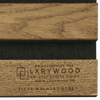Solid wood acoustic panels by LXRYWOOD, featuring natural oak and walnut grain patterns with black acoustic insert