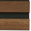 Solid wood acoustic panels by XRYWOOD featuring natural walnut finish with black acoustic fabric insert